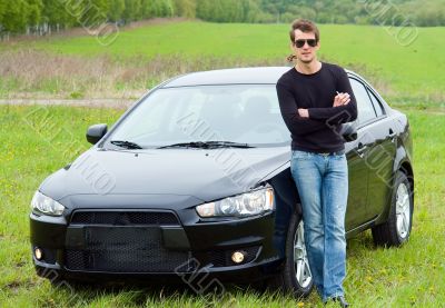 man against car