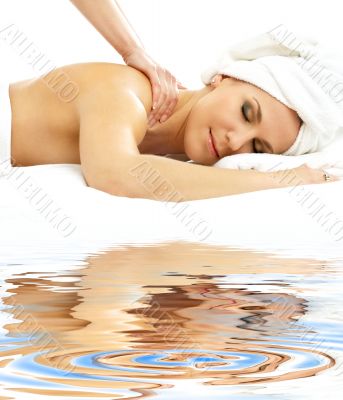 professional massage on white sand