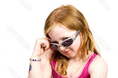 cute girl looking over her sunglasses