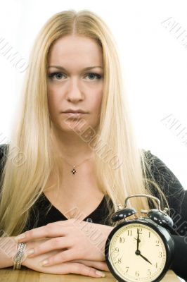 blond woman with clock