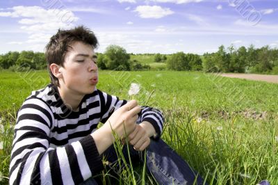 Teenager and dandelion