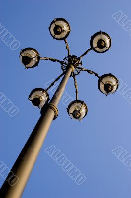 One lamp post on sky background
