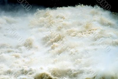 Water under a dam of hydroelectric power station