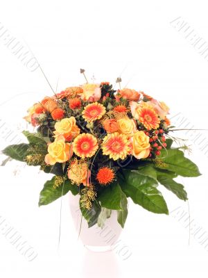 bouquet of roses and gerbera in galss vase on white