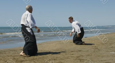 training of Aikido on the beach