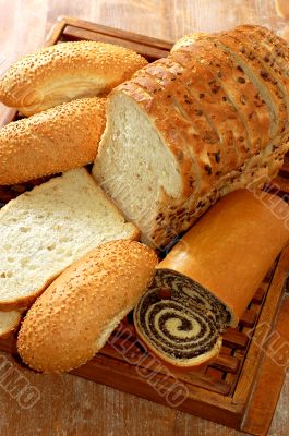 assortment of baked bread and other bakery products