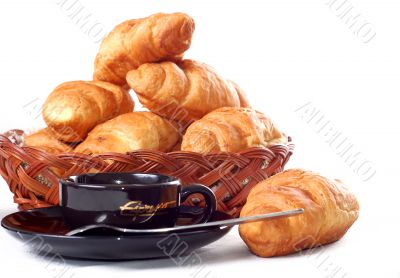cup of coffee with fresh croissants