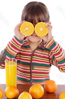 child with oranges