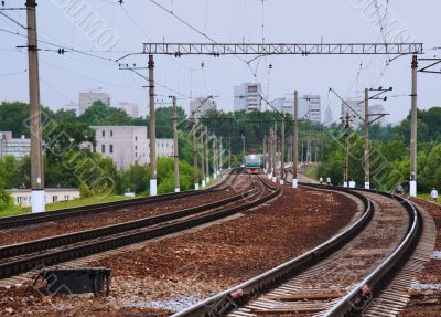 Passenger train arriving on station