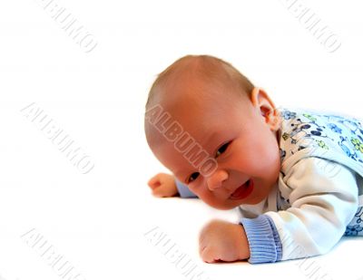 Beautiful kid lays on a stomach