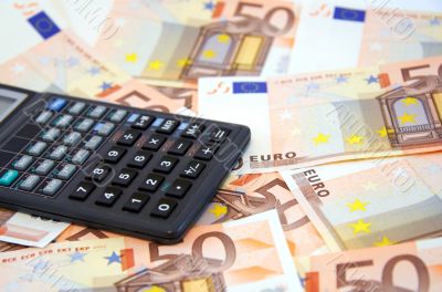 The calculator atop of euro banknotes