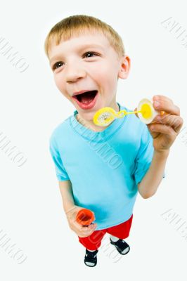 Boy blowing bubbles