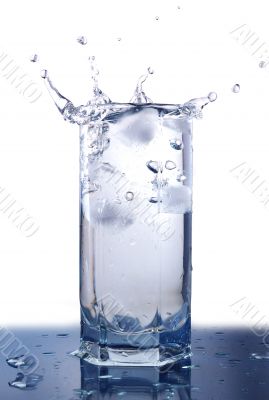 Splashing ice cubes in the glass