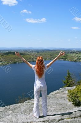 Happy woman on the mountain