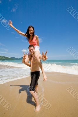 couple playful by the beach