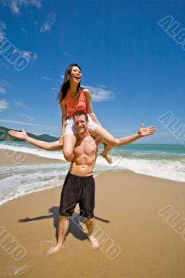 couple playful by the beach