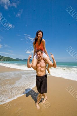 couple playful by the beach
