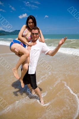 lovers having fun at the beach