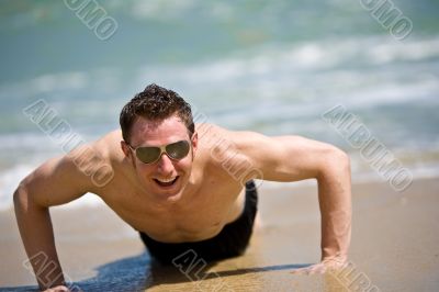 happy guys getting up from the beach