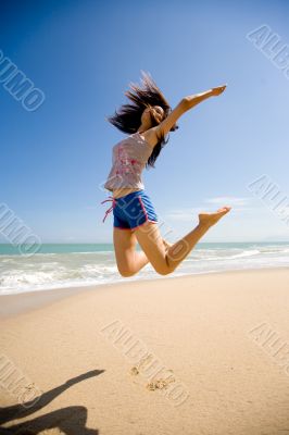 young woman jumping happily