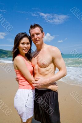 young couple by the beach