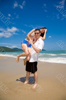 lovers having fun at the beach