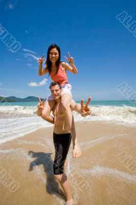couple playful by the beach