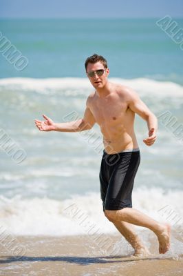 hunk having fun at the beach