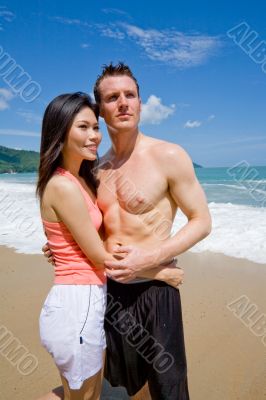 young couple by the beach