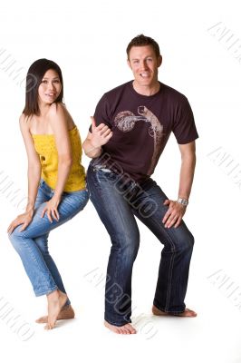 caucasian guy pointing to asian girl with him thumd