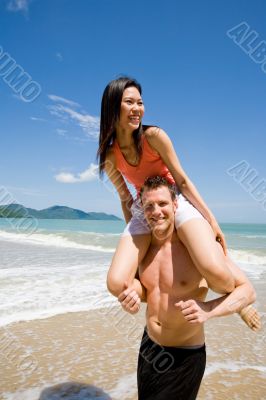 couple playful by the beach