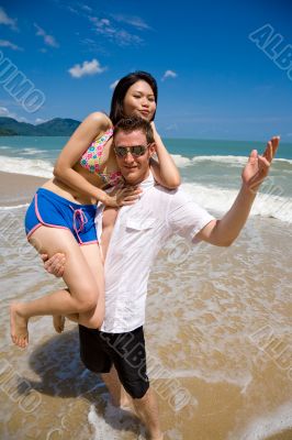 lovers having fun at the beach