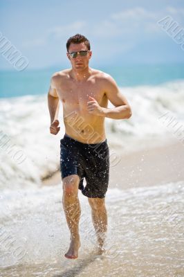 caucasian man running on the beach