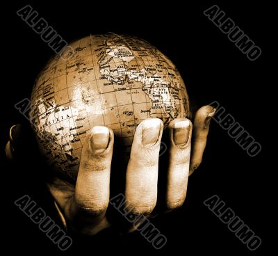 Globe in a girl`s hands