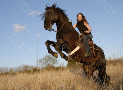 rearing stallion and girl