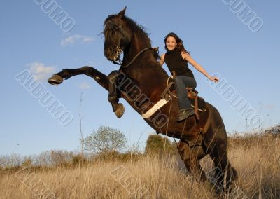 rearing stallion and girl
