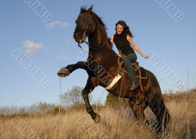 rearing stallion and girl