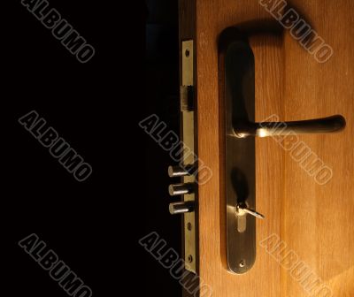 Opened door with lock and key