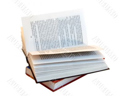 The opened book atop of other book