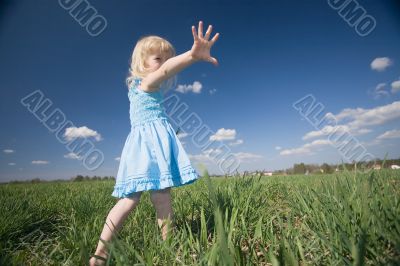 little girl on sunny meadow