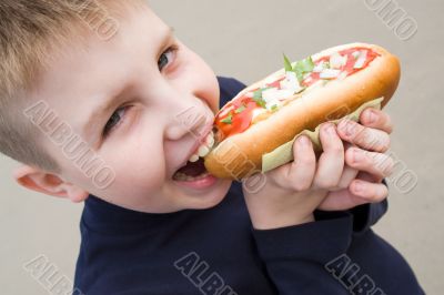 little boy with big sandwich