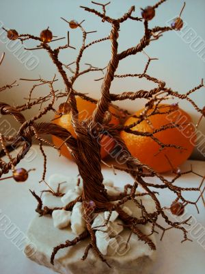 Copper tree and oranges