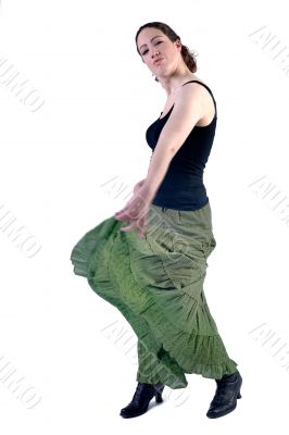Woman with long curly hair in a dress dancing
