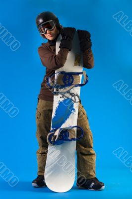 Woman with long curly hair presenting her snowboard