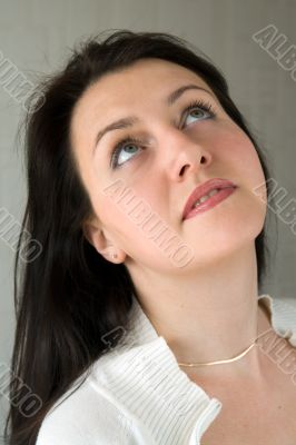 woman looks upwards