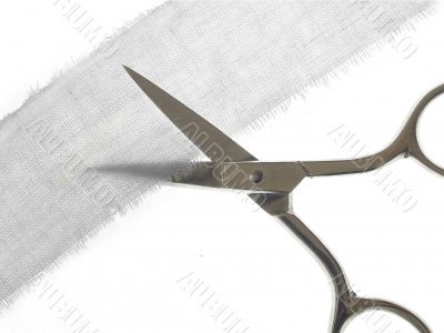 Scissors cutting fabric