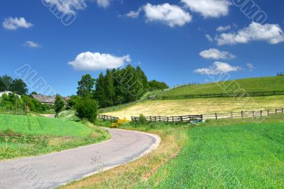 picturesque country road and fields