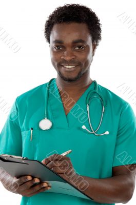 Young black doctor writing