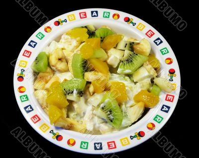 Fruit salad in a plate isolated