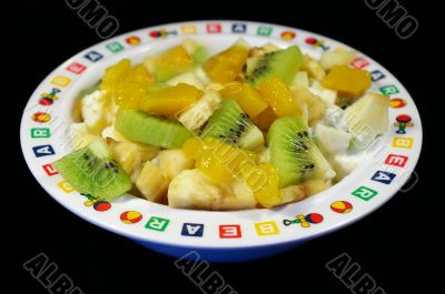 Fruit salad in a plate isolated